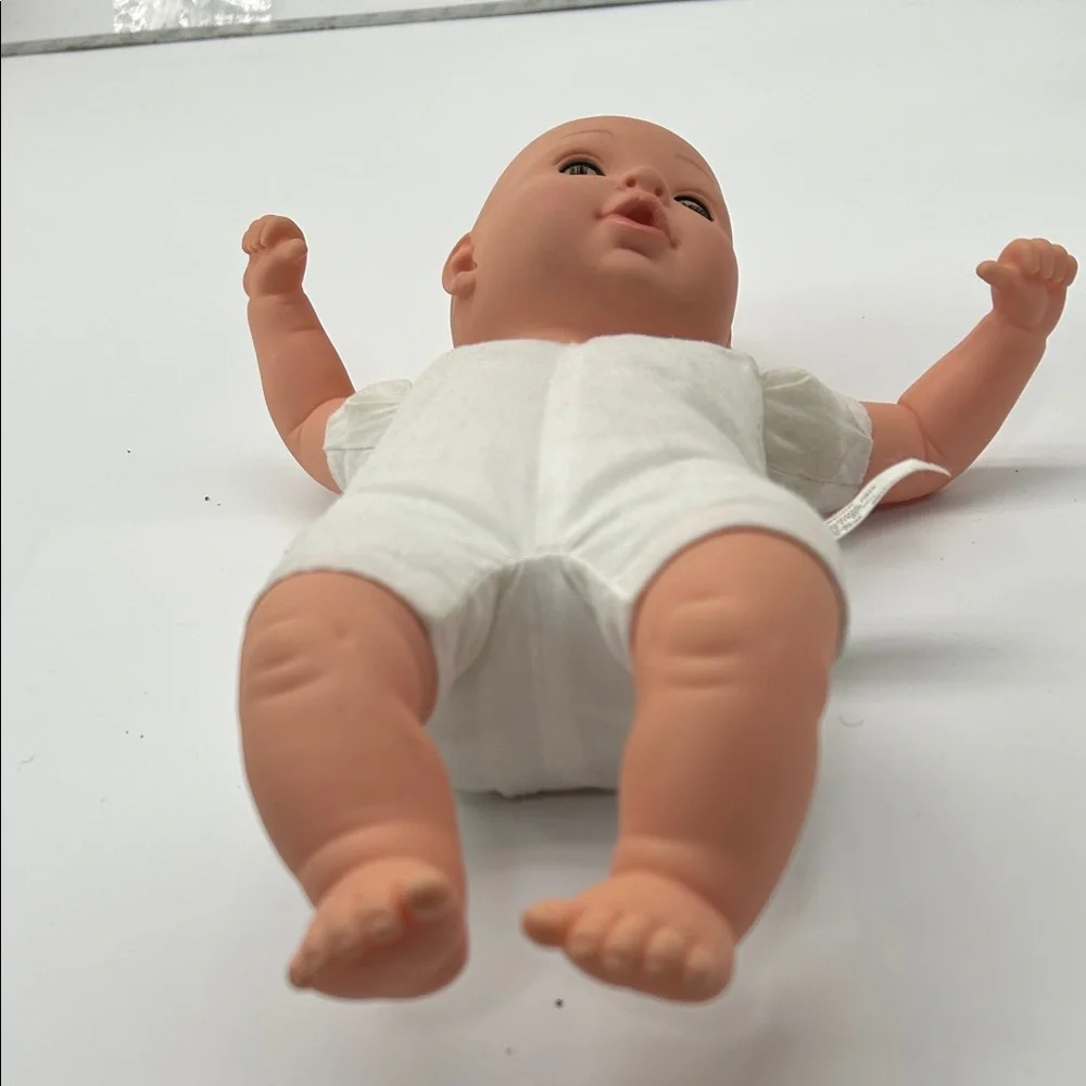 Realistic Baby Doll with White Outfit